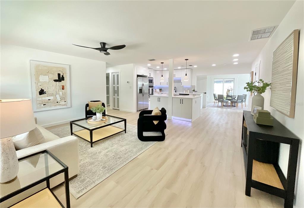 1290 Michigan Boulevard Dunedin, FL 34698 - Photo 2 of 45 a living room with furniture and a table