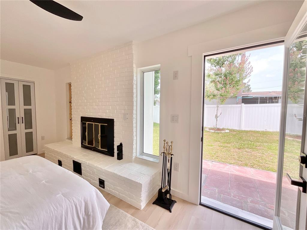 1290 Michigan Boulevard Dunedin, FL 34698 - Photo 24 of 45 a bedroom with a bed and a large window