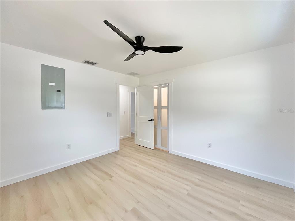 1290 Michigan Boulevard Dunedin, FL 34698 - Photo 30 of 45 wooden floor in an empty room