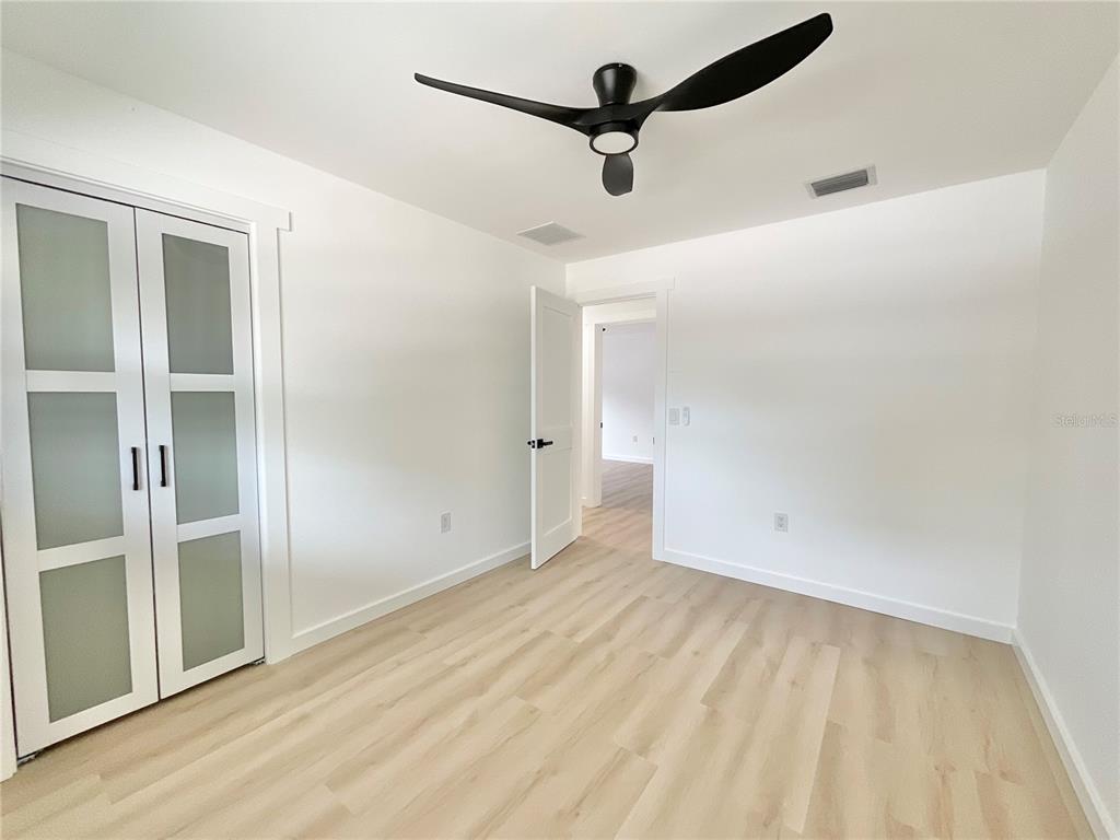 1290 Michigan Boulevard Dunedin, FL 34698 - Photo 31 of 45 an empty room with a empty space