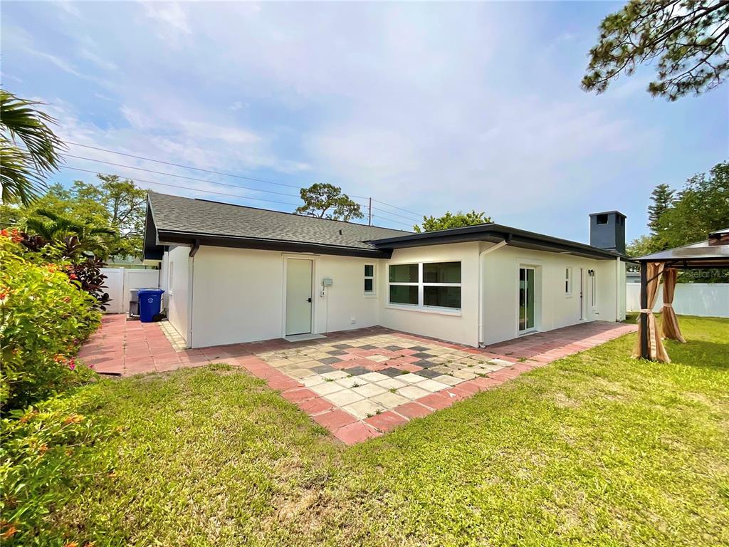 1290 Michigan Boulevard Dunedin, FL 34698 - Photo 37 of 45 a view of a backyard of the house