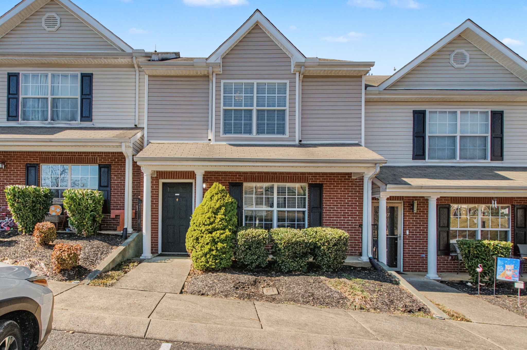 a front view of a house with garden