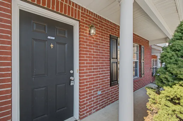 a view of a wooden door of the house