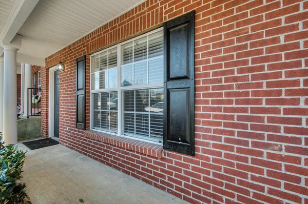a view of a brick wall with a window