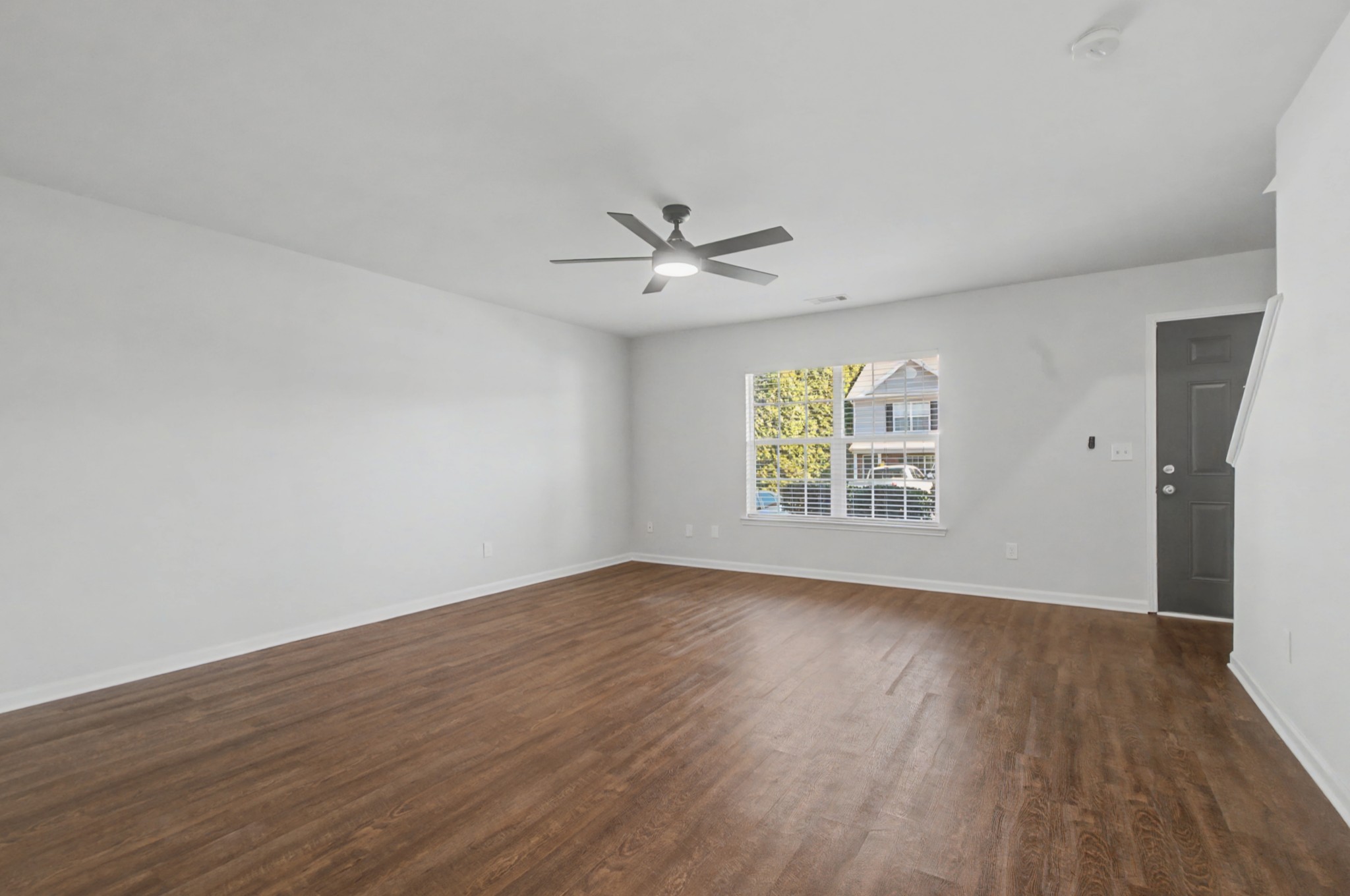 7405 Rice Court Fairview, TN 37062 - Photo 8 of 33 wooden floor in an empty room with a window