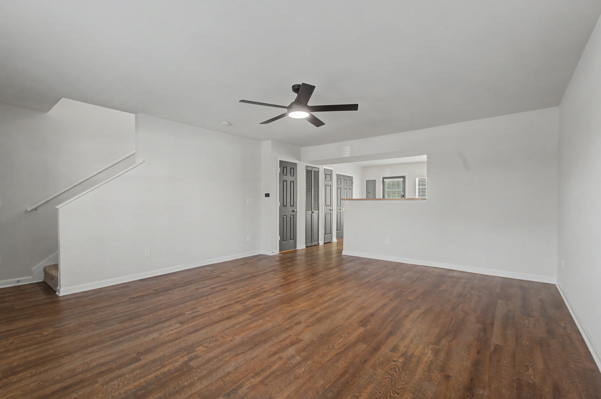 7405 Rice Court Fairview, TN 37062 - Photo 10 of 33 a view of a room with wooden floor and a ceiling fan
