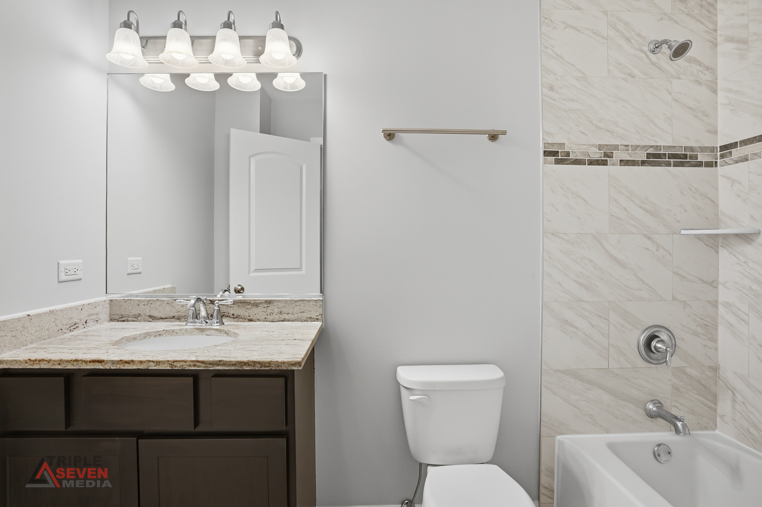 14528 Kolin Avenue Midlothian, IL 60445 - Photo 21 of 29 a bathroom with a sink vanity granite toilet and a mirror