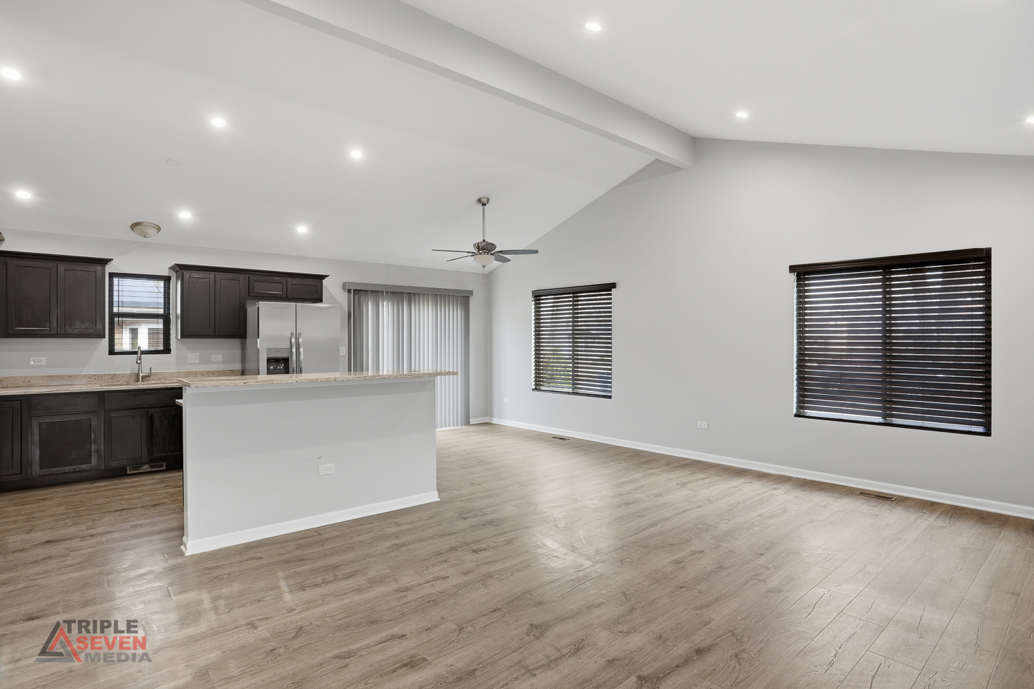 14528 Kolin Avenue Midlothian, IL 60445 - Photo 7 of 29 a view of an empty room with kitchen and window