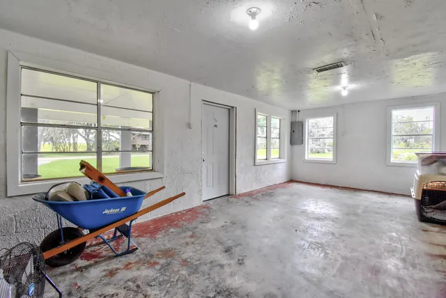 a view of a house with backyard and porch