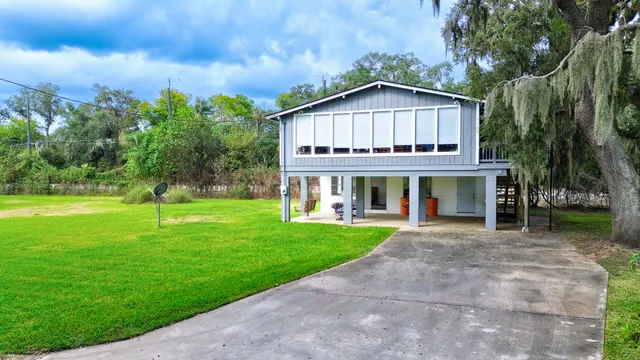 a view of a house with a big yard