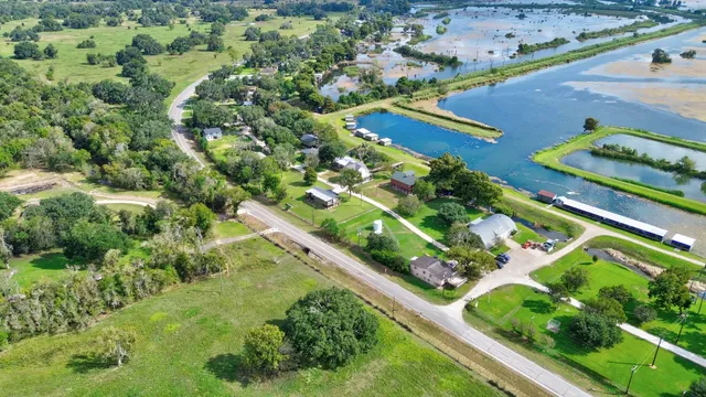 an aerial view of residential houses with outdoor space