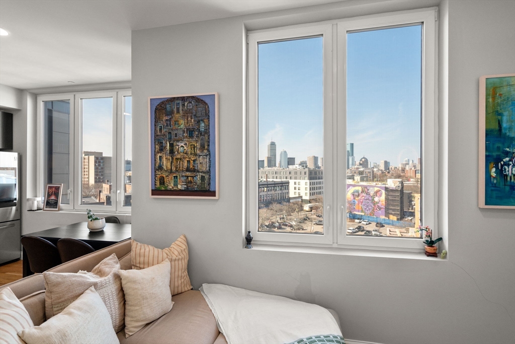 10 Taber Street, Unit 608 Boston, MA 02119 - Photo 17 of 20 a living room with furniture and windows