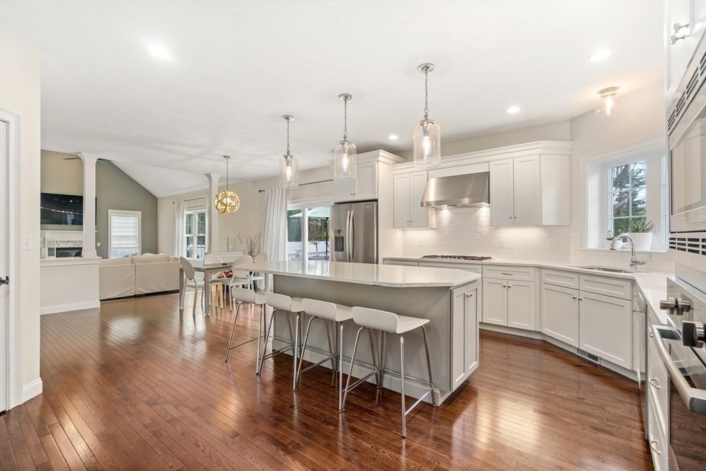 3 Dutton Drive Mansfield, MA 02048 - Photo 13 of 42 a large kitchen with lots of counter and chairs