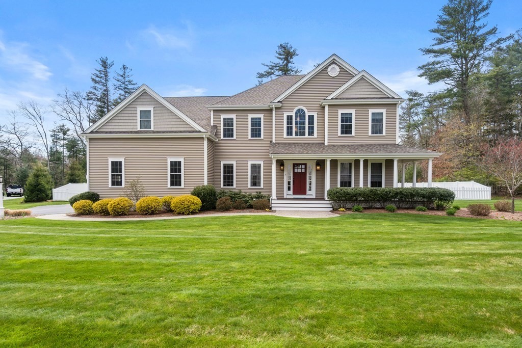 3 Dutton Drive Mansfield, MA 02048 - Photo 2 of 42 a front view of a house with a garden