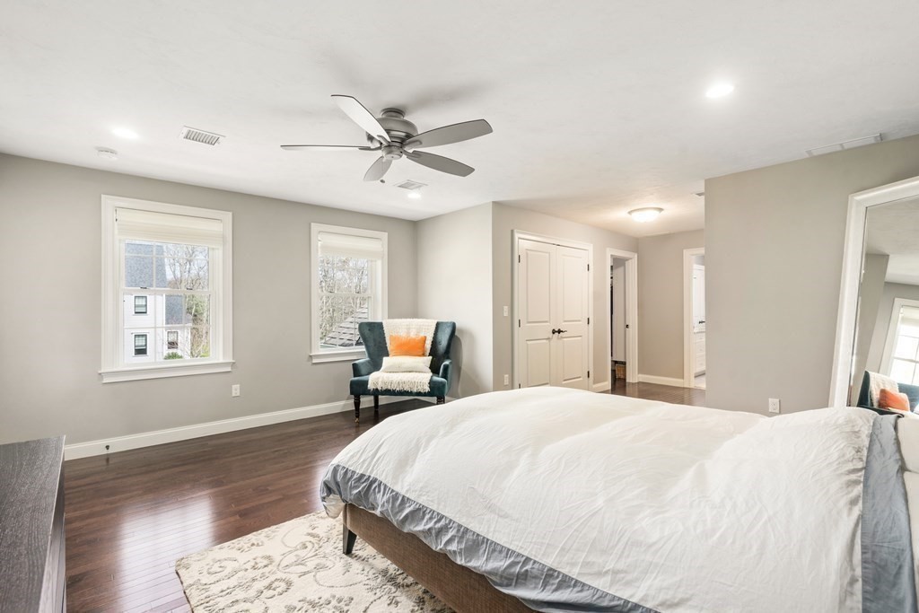 3 Dutton Drive Mansfield, MA 02048 - Photo 29 of 42 a spacious bedroom with a bed a mirror and a window