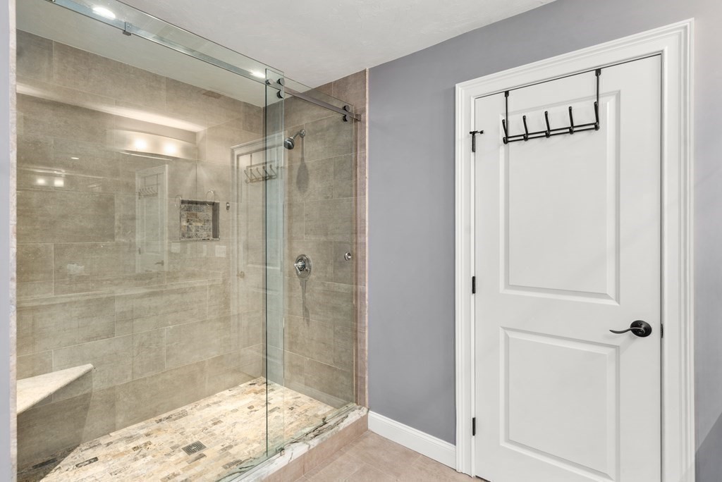 3 Dutton Drive Mansfield, MA 02048 - Photo 31 of 42 a bathroom with a glass shower door