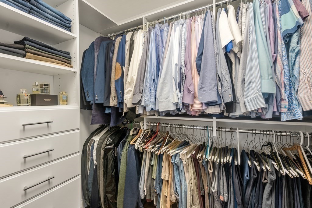 3 Dutton Drive Mansfield, MA 02048 - Photo 33 of 42 a view of walk in closet with clothes and shoes
