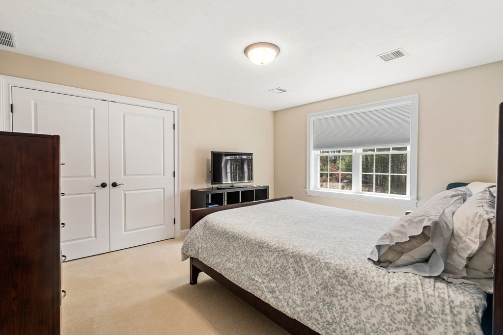 3 Dutton Drive Mansfield, MA 02048 - Photo 35 of 42 a bedroom with a bed and a tv