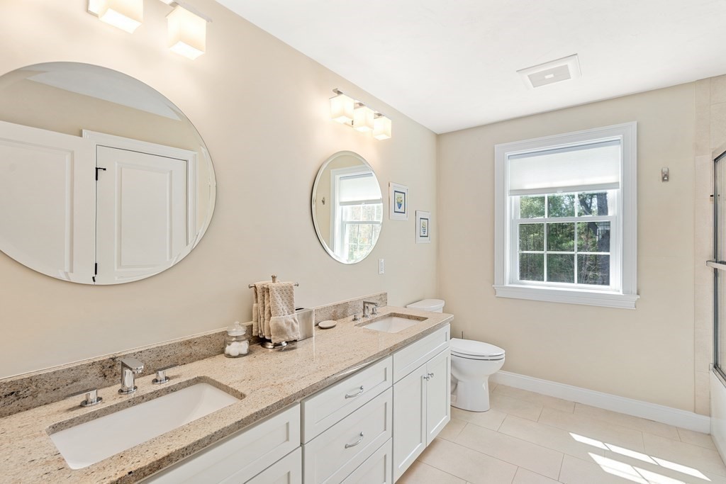 3 Dutton Drive Mansfield, MA 02048 - Photo 37 of 42 a bathroom with a double vanity sink and a mirror