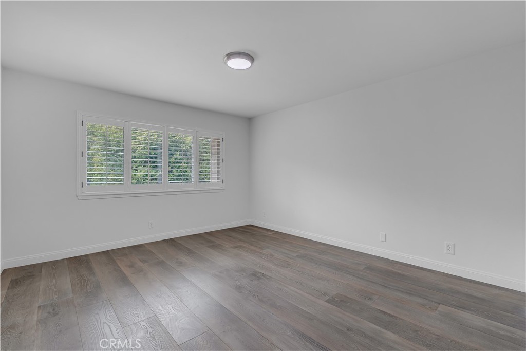 19451 Eagle Ridge Lane Porter Ranch, CA 91326 - Photo 32 of 59 an empty room with wooden floor and windows