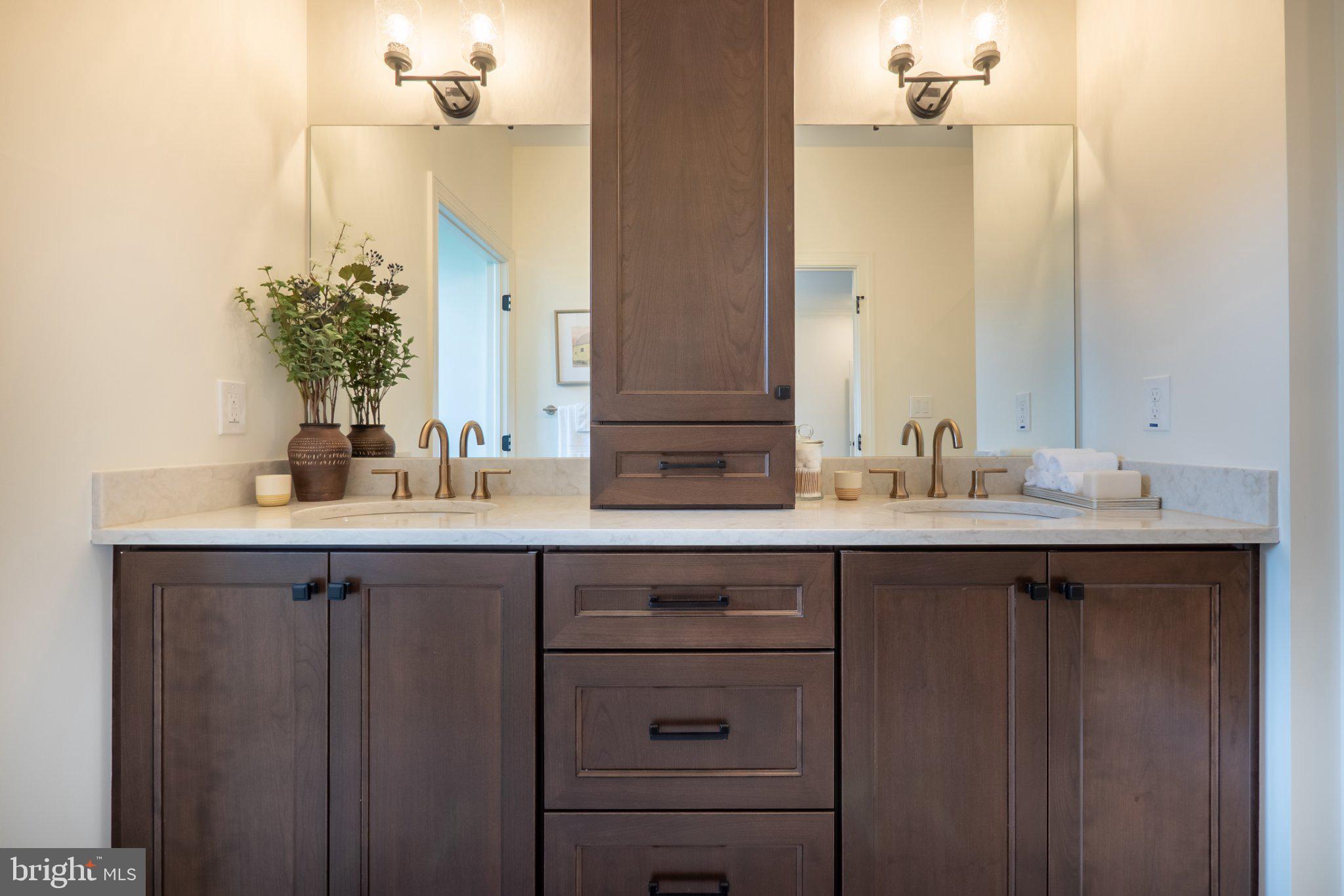 4630 Old Saucon Road Bethlehem, PA 18015 - Photo 22 of 33 a bathroom with a double vanity sink and a mirror