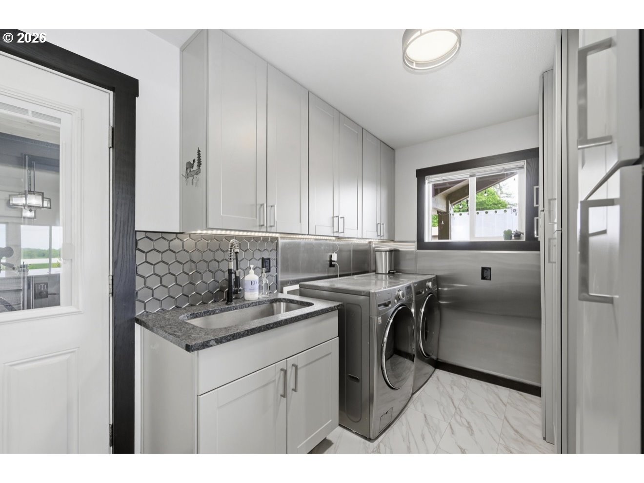 33192 Wilkins Road Eugene, OR 97408 - Photo 24 of 35 a kitchen with a sink cabinets and a window