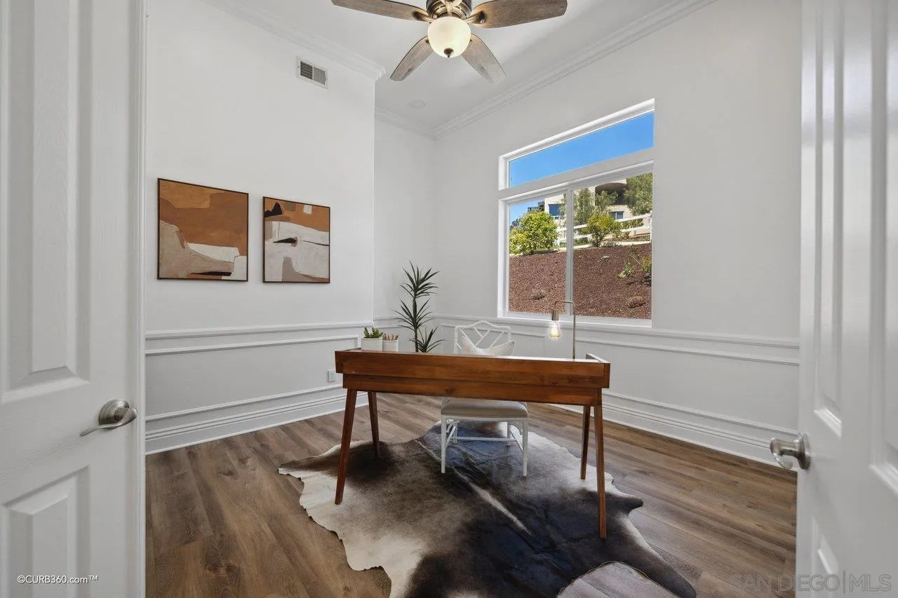 17035 Edina Court Poway, CA 92064 - Photo 11 of 52 a view of a workspace with furniture and a window