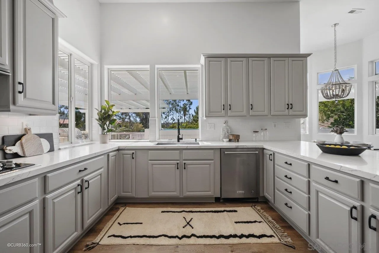 17035 Edina Court Poway, CA 92064 - Photo 15 of 52 a kitchen with sink cabinets and window