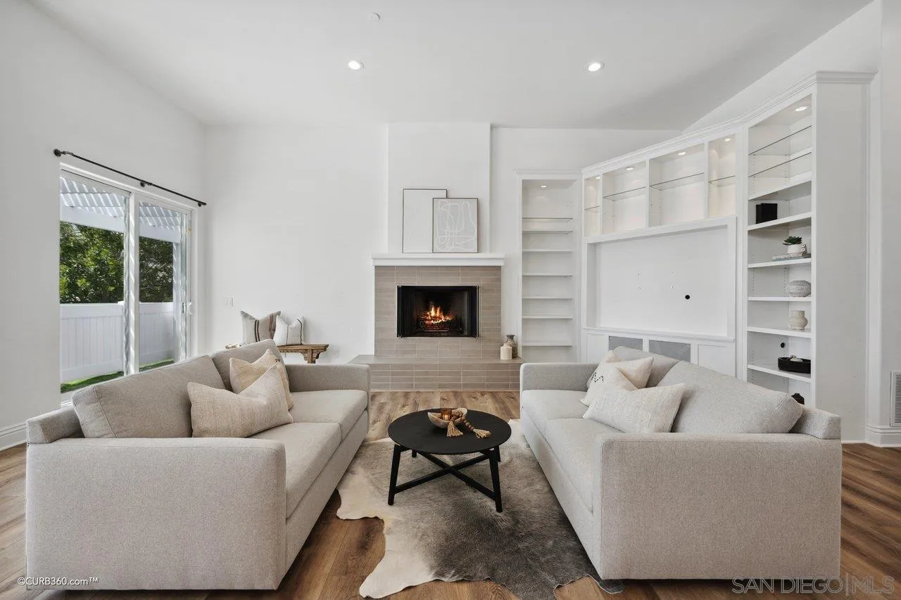 17035 Edina Court Poway, CA 92064 - Photo 18 of 52 a living room with furniture fireplace and a window