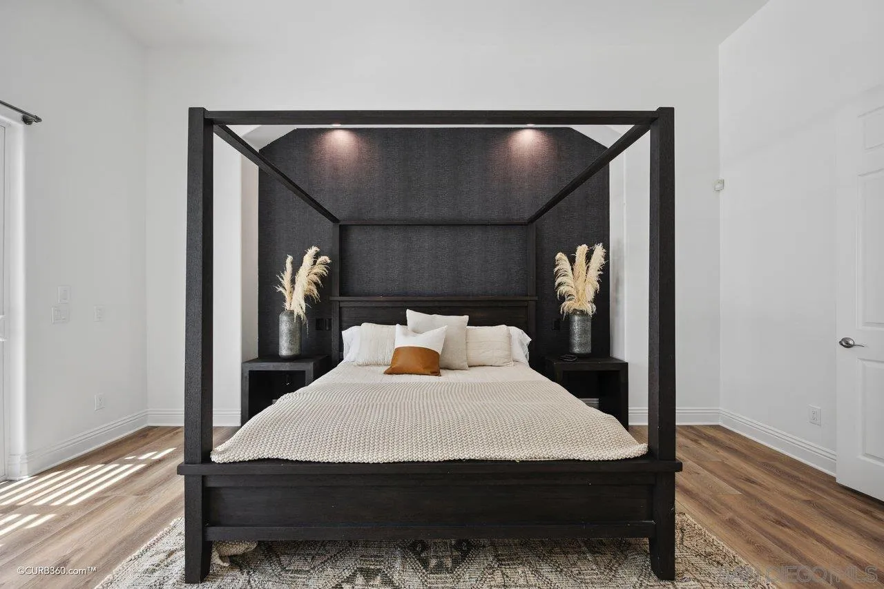 17035 Edina Court Poway, CA 92064 - Photo 21 of 52 a bed room with a bed and a potted plant