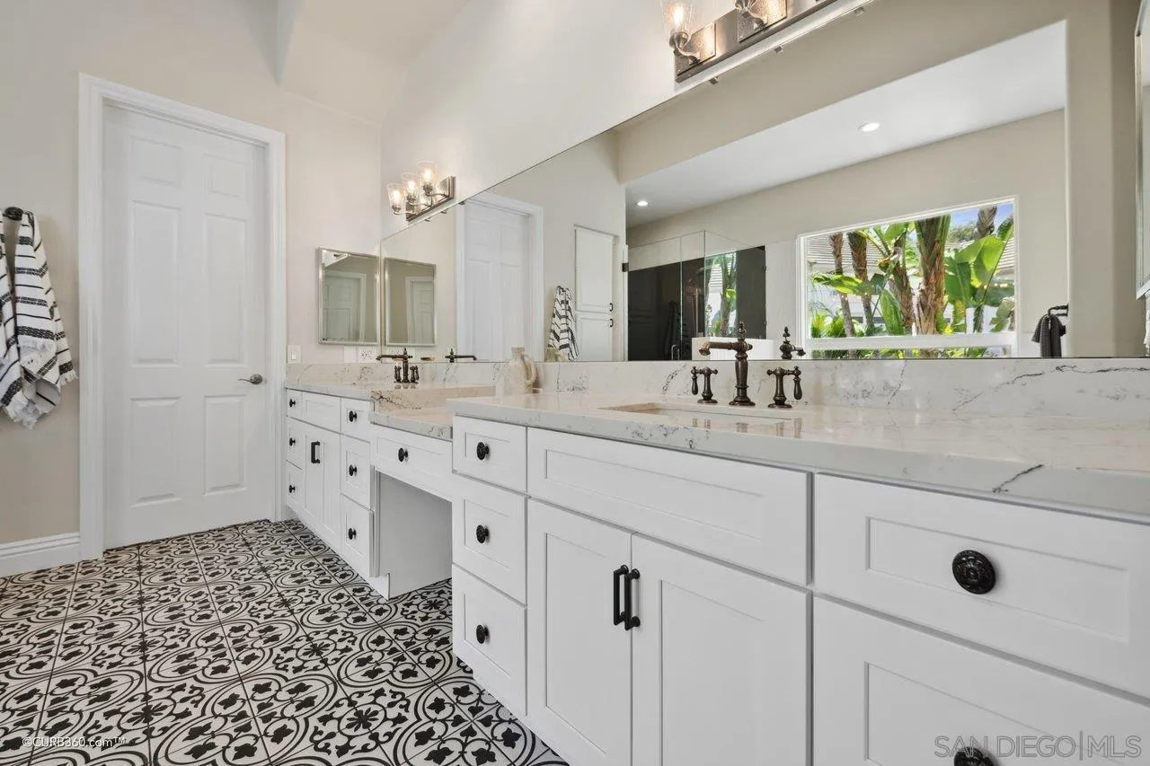 17035 Edina Court Poway, CA 92064 - Photo 25 of 52 a bathroom with a double vanity sink mirror and shower