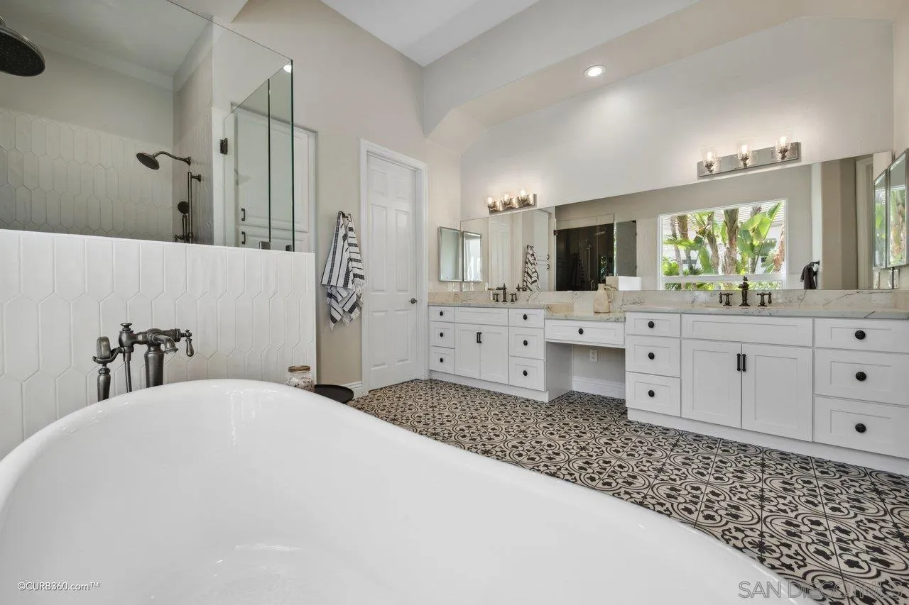 17035 Edina Court Poway, CA 92064 - Photo 26 of 52 a bathroom with a double vanity sink mirror and bathtub