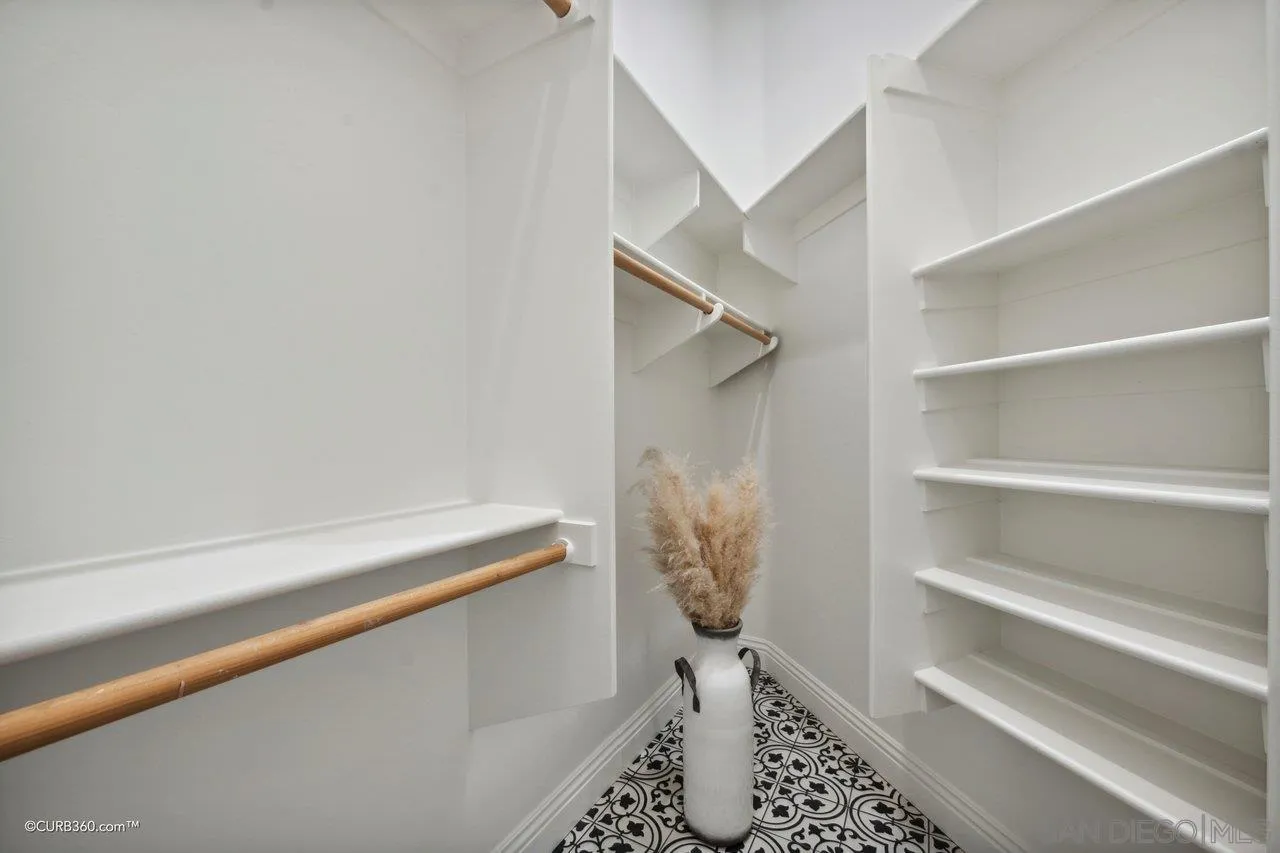 17035 Edina Court Poway, CA 92064 - Photo 28 of 52 a room with a walk in closet and wooden floor