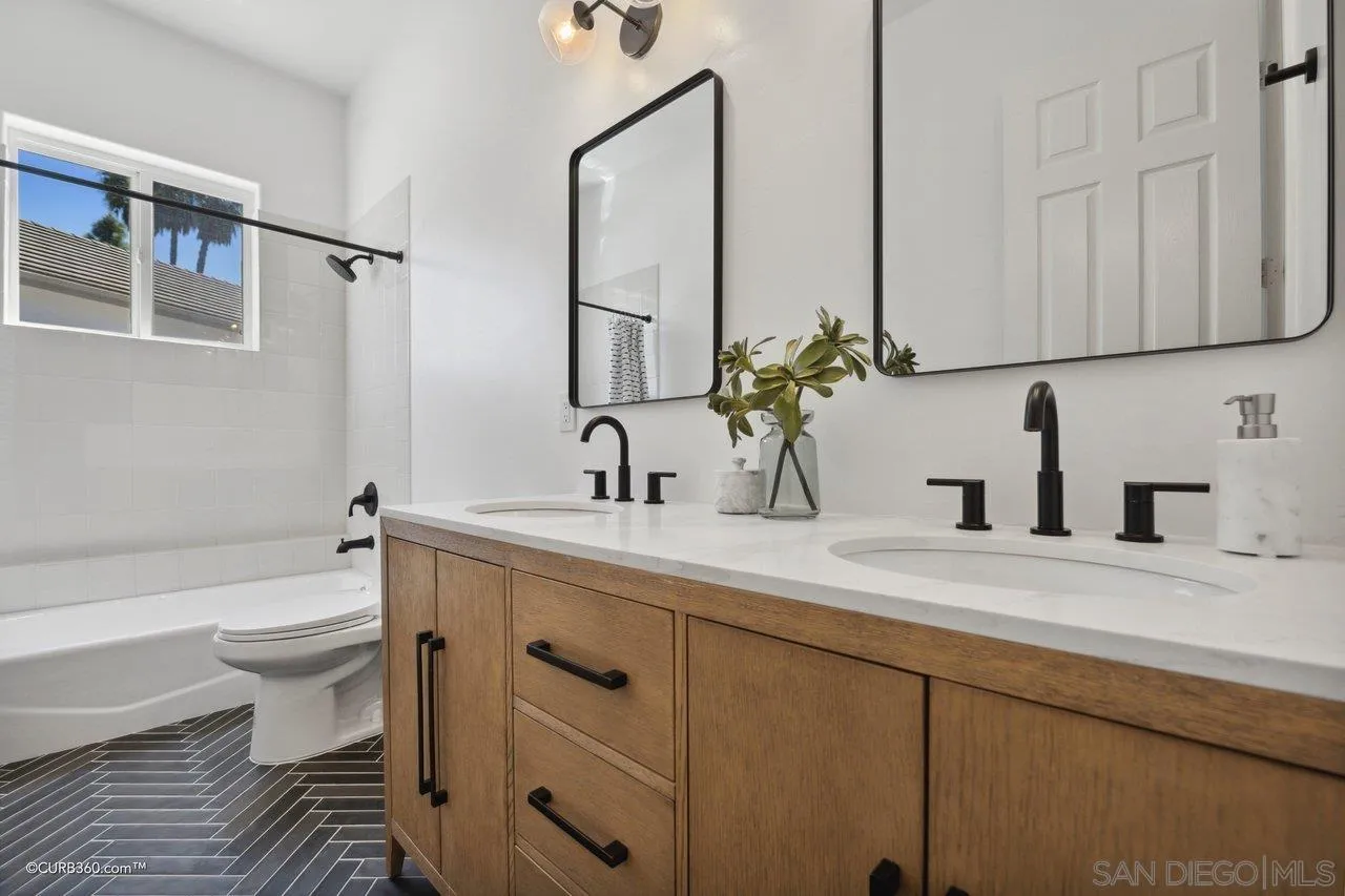 17035 Edina Court Poway, CA 92064 - Photo 31 of 52 a bathroom with a sink a toilet and bathtub
