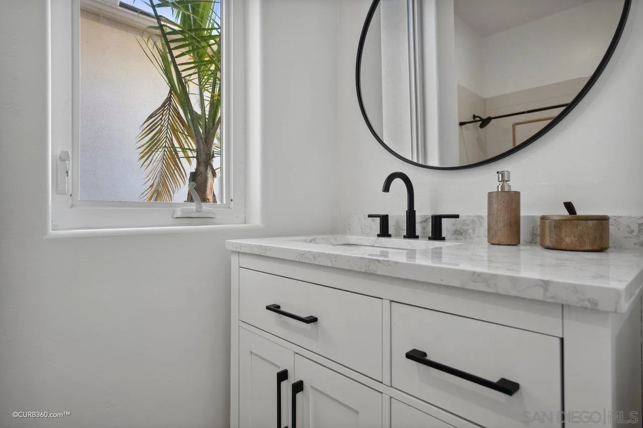 17035 Edina Court Poway, CA 92064 - Photo 33 of 52 a bathroom with a sink and a mirror