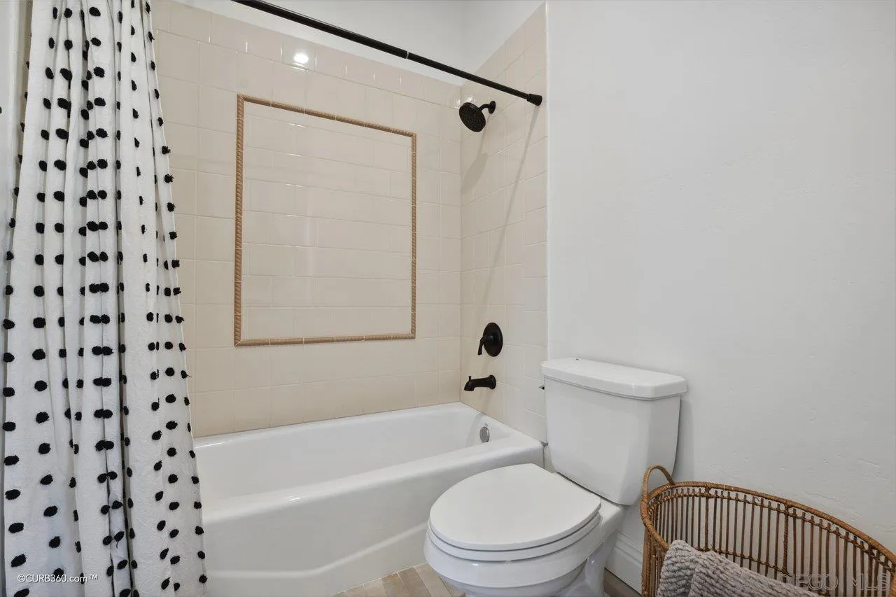 17035 Edina Court Poway, CA 92064 - Photo 34 of 52 a white toilet sitting next to a bath tub