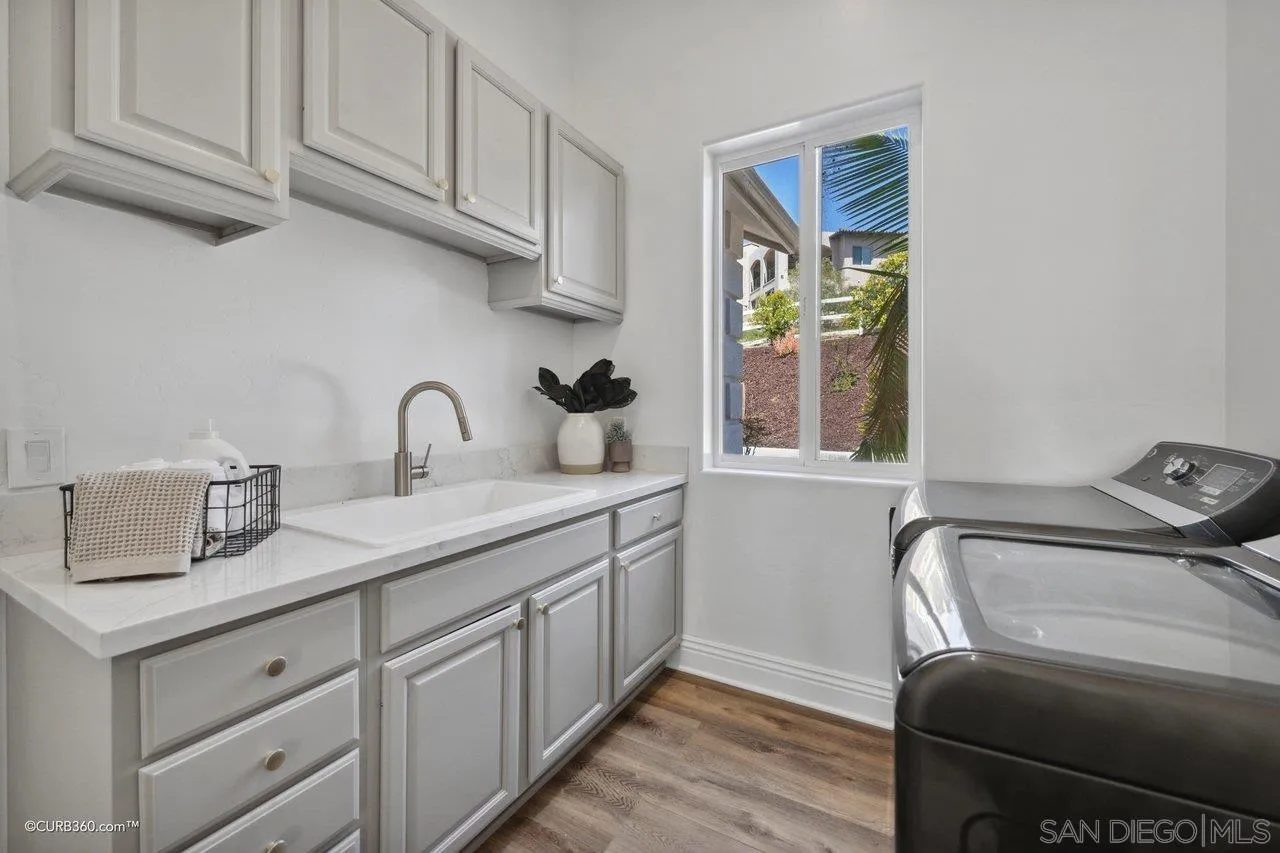 17035 Edina Court Poway, CA 92064 - Photo 35 of 52 a kitchen with stainless steel appliances granite countertop a sink a stove and cabinets