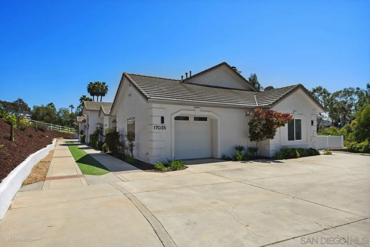 17035 Edina Court Poway, CA 92064 - Photo 49 of 52 a front view of a house with a yard and garage