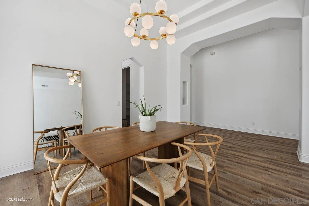 17035 Edina Court Poway, CA 92064 - Photo 8 of 52 a view of a dining room with furniture and wooden floor