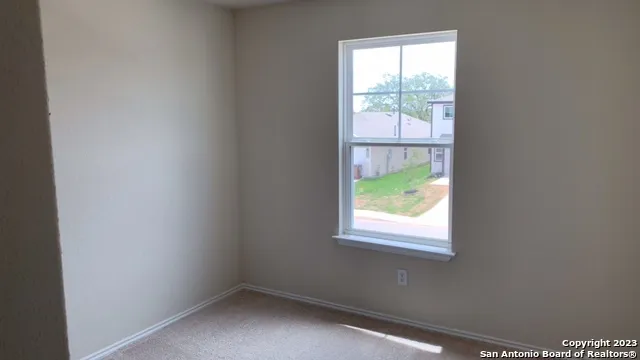 a view of a window in an empty room