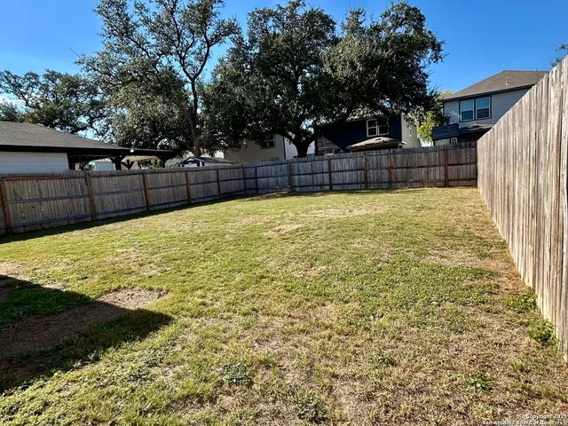 a bathroom with a sink and a yard