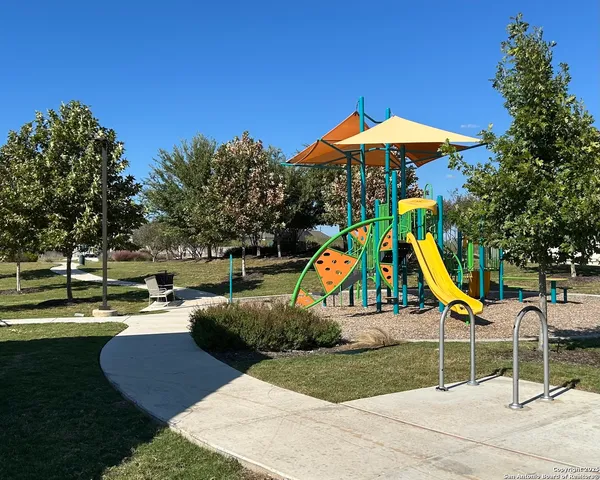 a view of a chairs and table in patio