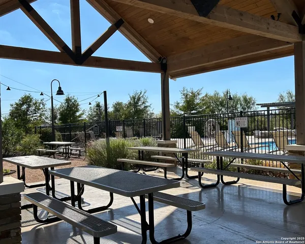 a view of a backyard with sitting area