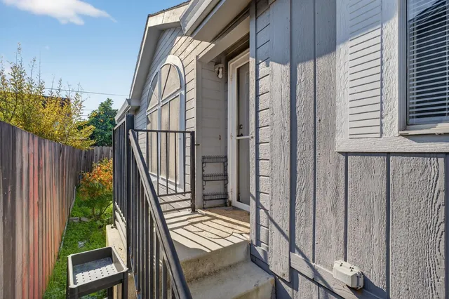 a view of balcony with wooden floor and stairs