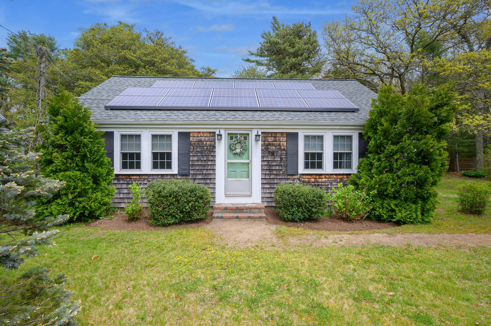 346 Old Stage Road Centerville, MA 02632 - Photo 2 of 23 a view of a house with a yard