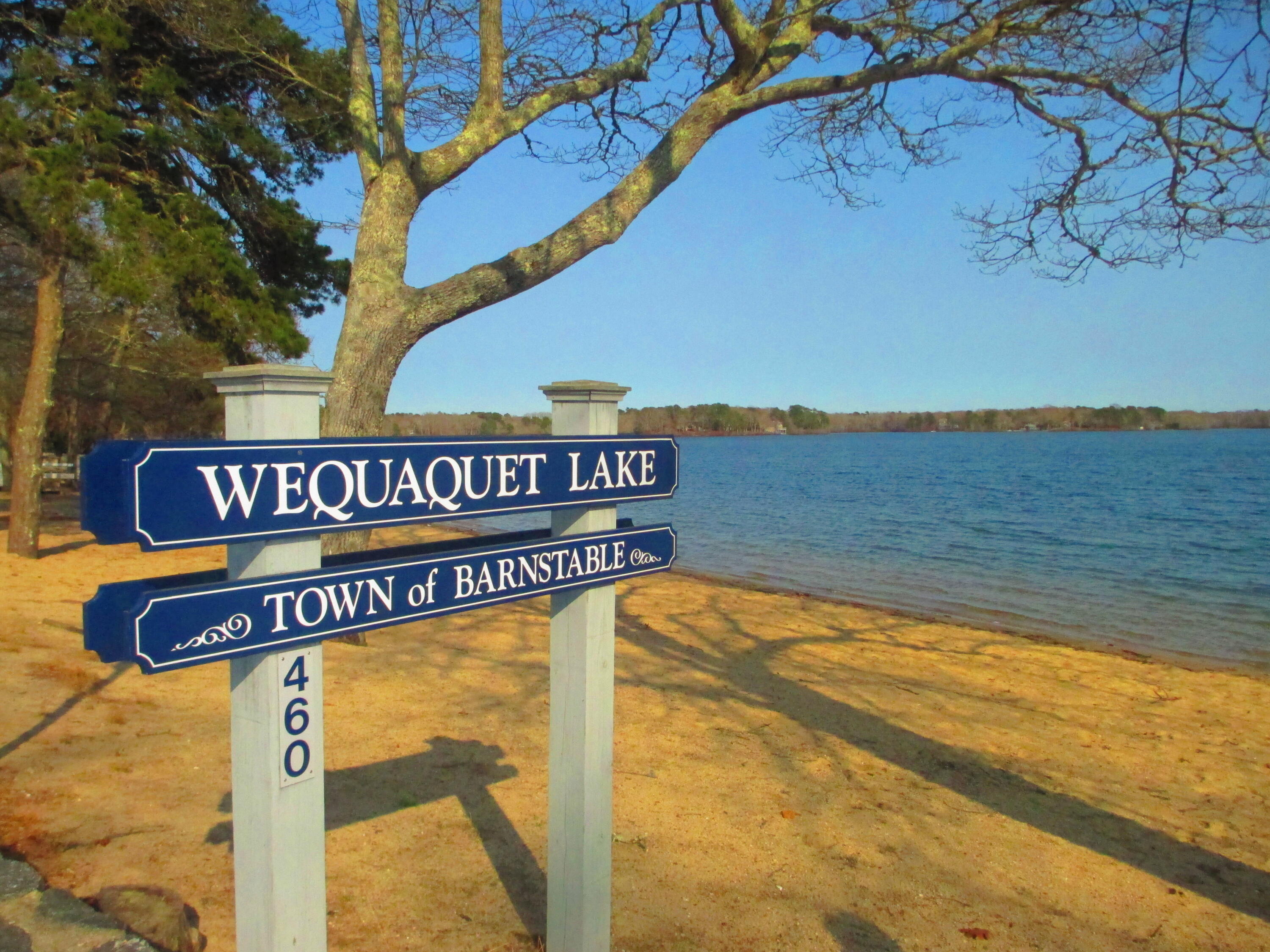 346 Old Stage Road Centerville, MA 02632 - Photo 23 of 23 a street sign on a wall next to a road