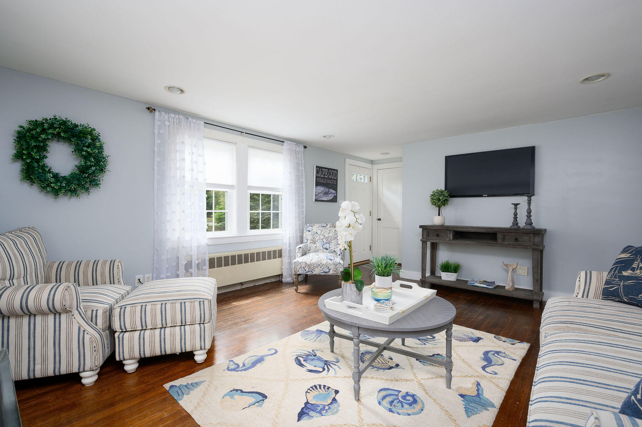 346 Old Stage Road Centerville, MA 02632 - Photo 6 of 23 a living room with furniture and a flat screen tv