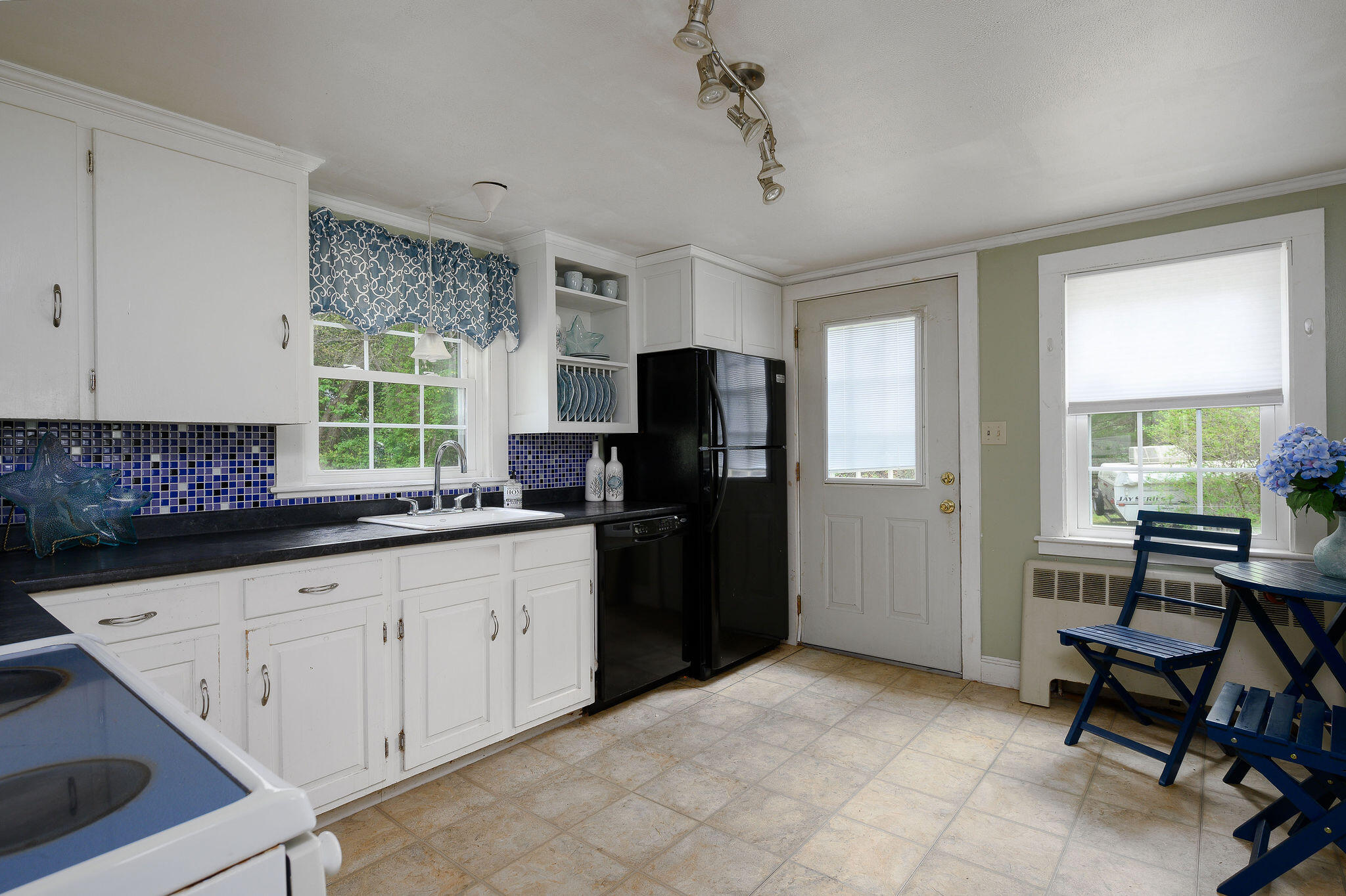 346 Old Stage Road Centerville, MA 02632 - Photo 8 of 23 a kitchen with stainless steel appliances granite countertop a refrigerator and a sink