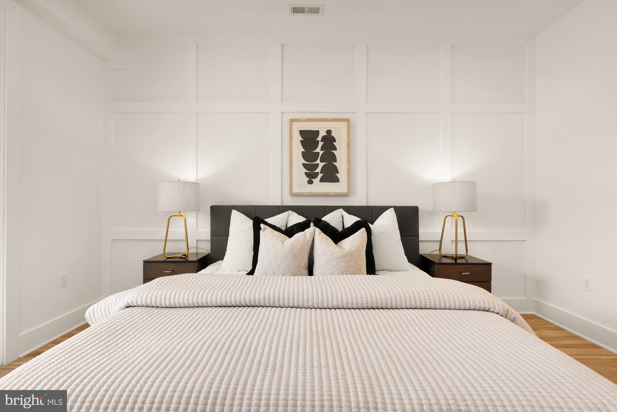 1251 Morse Street Northeast, Unit B Washington, DC 20002 - Photo 18 of 37 a bedroom with a bed and a night stand