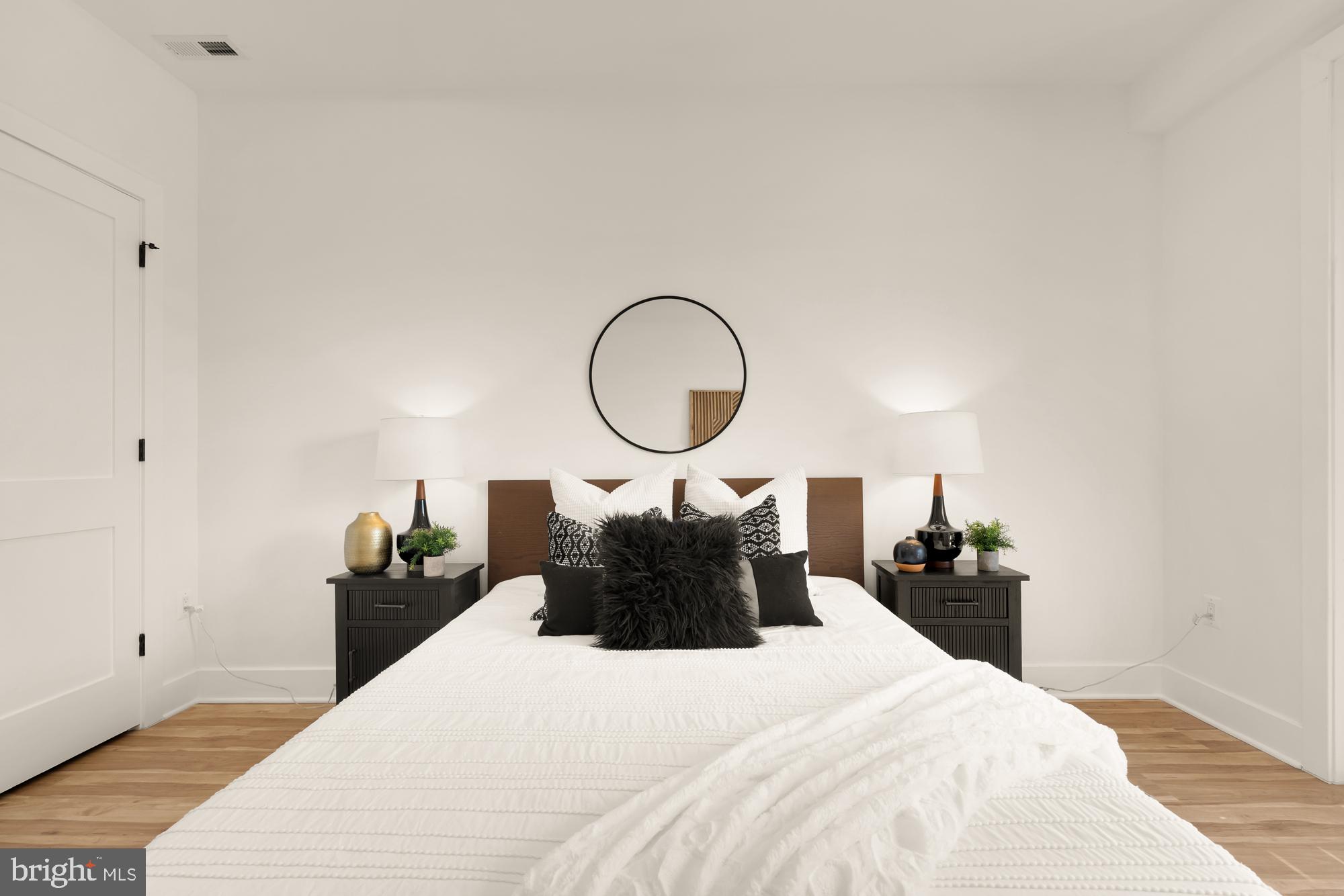 1251 Morse Street Northeast, Unit B Washington, DC 20002 - Photo 24 of 37 a bedroom with a bed and a mirror